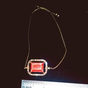 Gold Tone Bracelet with Sparkly Orange Pendant with Diamond cz Trim